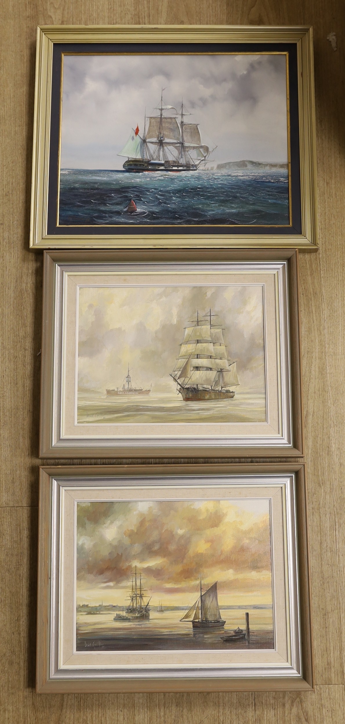 David Griffin (1952-2002), pair of oils on canvas, 'East Goodwin Lightship' and 'Shipping at sunset', signed and dated '82, 30 x 40cm and an oil of a sailing ship by another hand, 40 x 50cm